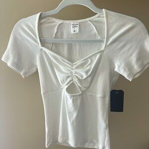 Cute cut out top! NEVER WORN TAG STILL ON